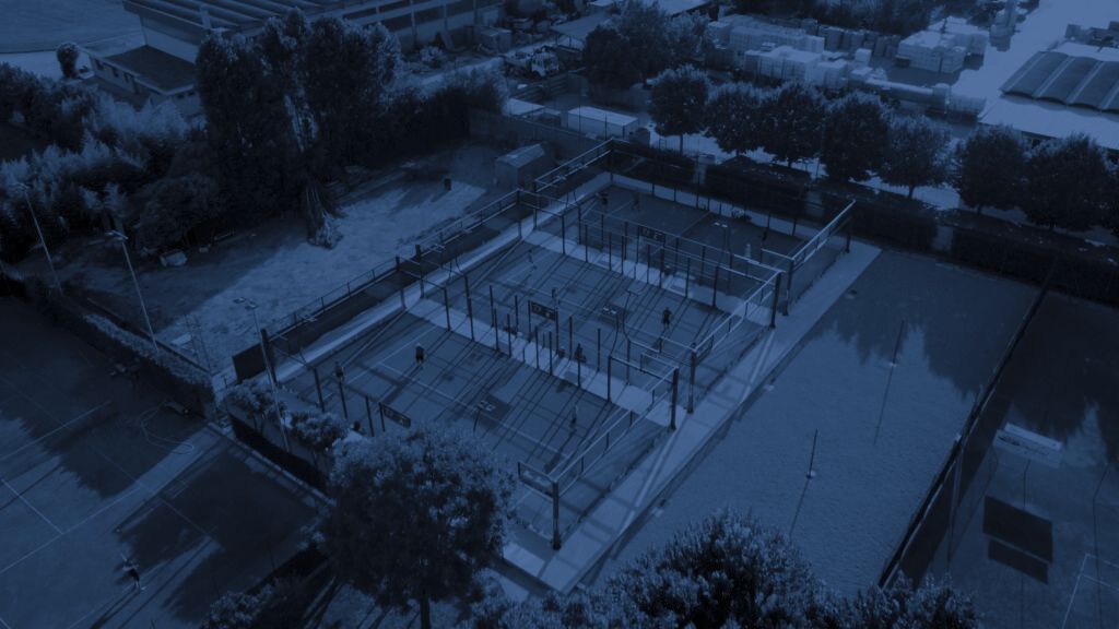 Padel court under floodlights at night
